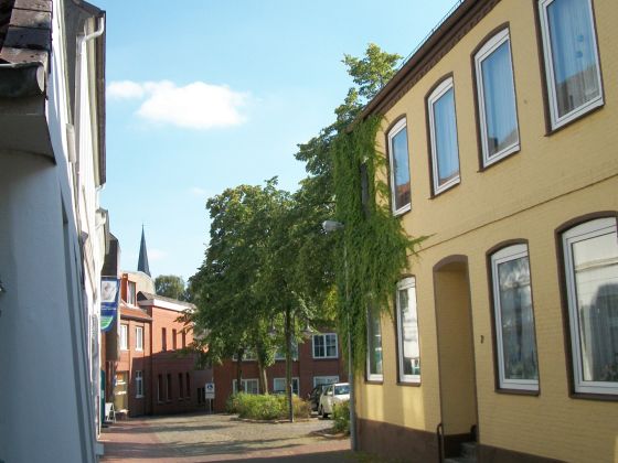 You will be guest in the yellow painted house on the right