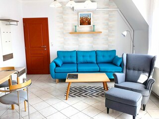 Every Apartment with couch&armchair in the living room.