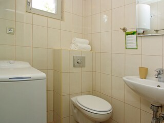 bathroom with washing machine