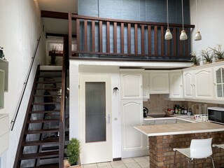 Kitchen and stairs to mezzanine bedroom