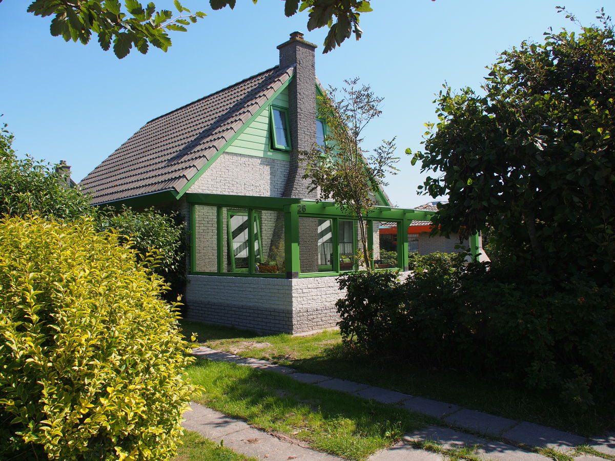 south-western side with parking place and roofed place.