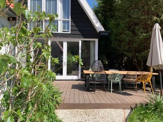 Large outside dining area with sun umbrella