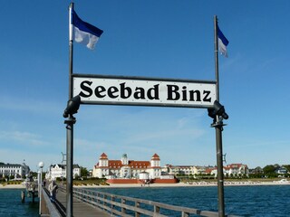 The pier with the imposing hotel in the background