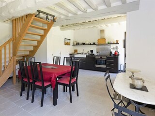 The dining table and kitchen