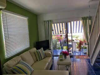 The sitting room is colourfully decorated.