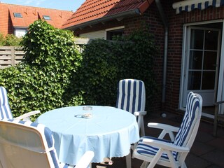 Fenced terrace with blinds...
