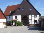 Frontal view of the house and forecourt