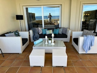 sytlish outside lunge area with frontal seaviews