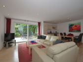 Livingroom-Kitchen, large sliding window to the Garden