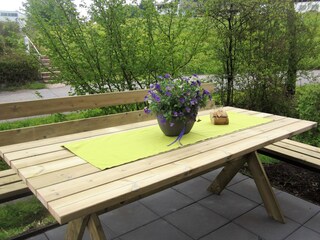 Idyllic seating area by the stream