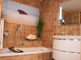 Bathroom with rain shower (not in photo) and bathtub