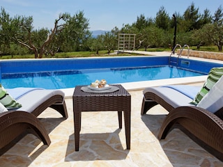 loungers by the pool