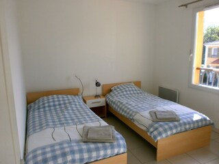 Bedroom 1 with 2 single beds