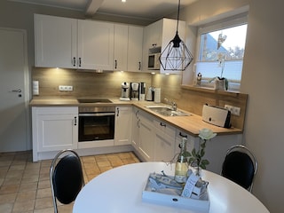 Holiday Home Nordseejuwel kitchen and dining corner