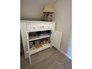 Holiday Home Nordseejuwel games cupboard