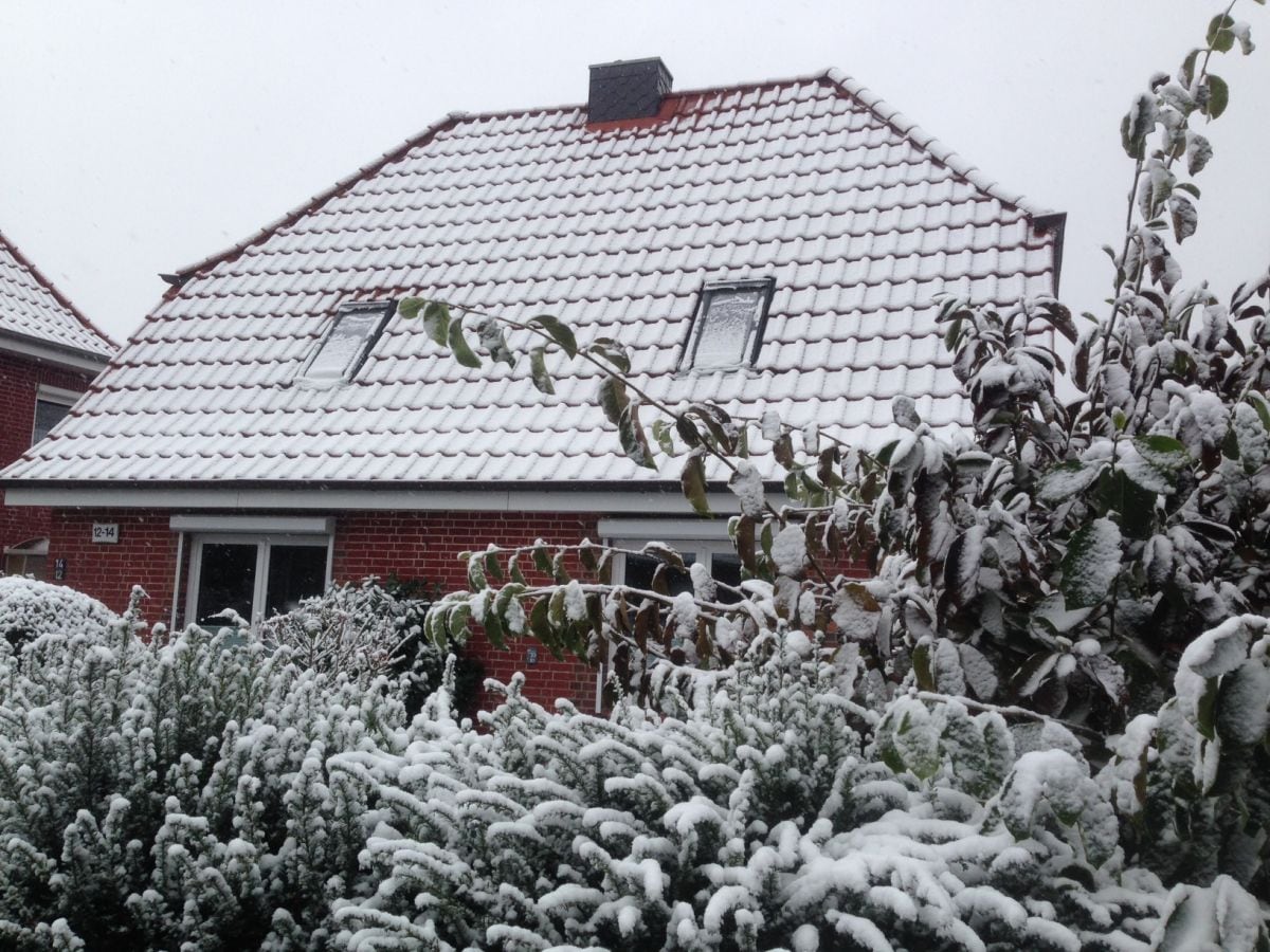 front of the house in the winter wonderland of Hamburg