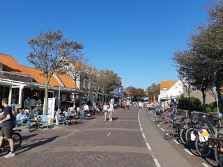 Main street of Domburg with cozy terraces.