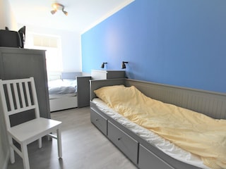 Schlafzimmer mit 3 Betten