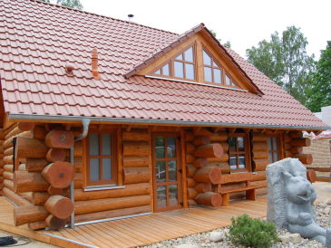 Holiday apartment Sunrise im Naturstamm Ferienhaus