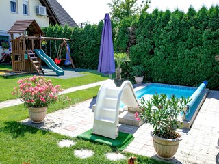 Solar heated kid's pool with water slide