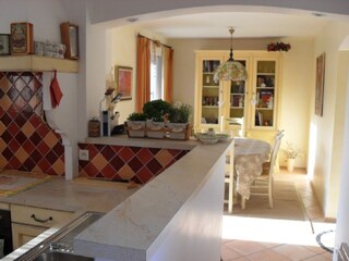 Open kitchen with dining room