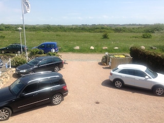 parking space and view from the house up to the meadows