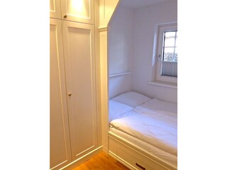 view to the bed in the bedroom