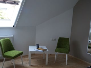 Schlafzimmer 1 mit Sitzecke Müritz-Idylle