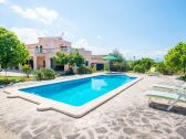 Pool with sun loungers in the outdoor area