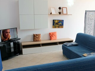 Gemütliche Sitzecke mit TV und WLAN