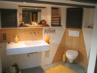 Mediterranean-style bathroom with window