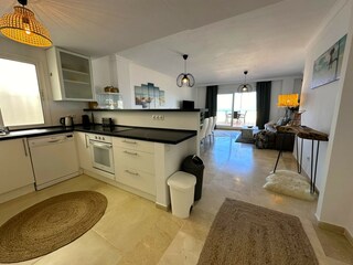 new open plan kitchen with views in to living room