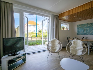 Wohnzimmer mit Flügeltüren