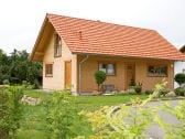 Blick auf unser Blockhaus von der Wohnstraße aus