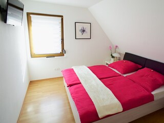 Bedroom 1 with cable TV.