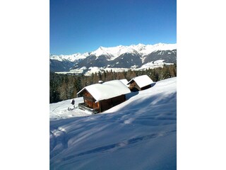 snowy alpine hut