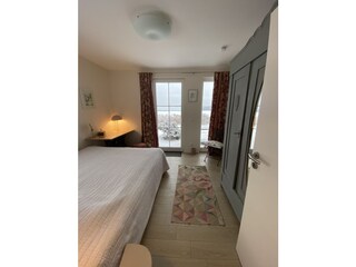 Bedroom on the ground floor with a view over the fields