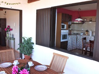 Covered terrace and view to kitchen