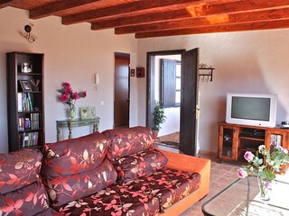 Living room with couch and SAT-TV