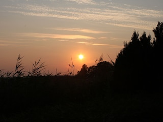 Blick von der Terrasse beim Sonnenuntergang