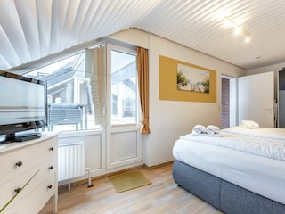 Schlafzimmer mit Balkonzugang