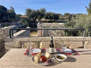 Enjoy cheese, olives and wine in the evening sun