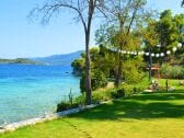 Garden and sandy beach