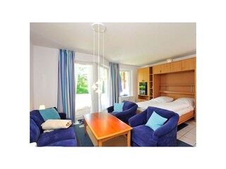 Wohnzimmer mit Schrankbett - Haus Sommerdeich, Wohnung 3A, Westmarken 37a+b, St. Peter-Bad