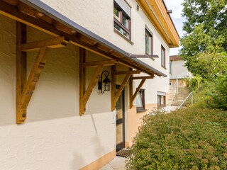 Front door and stairs to rear garden