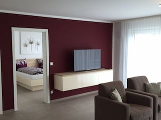 Living room with view to the bed room