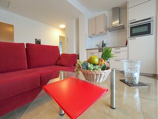 Strandpalais Ferienwohnung 15 -  Wohnzimmer mit Küche