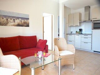 Strandpalais Ferienwohnung 17 -  Wohnzimmer mit Küche