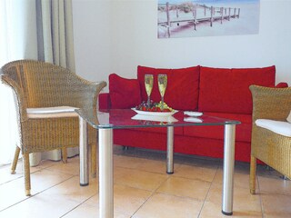 Strandpalais Ferienwohnung 26 -  Wohnzimmer mit Küche