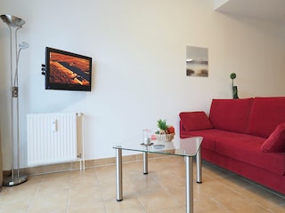 Strandpalais Ferienwohnung 28 -  Wohnzimmer